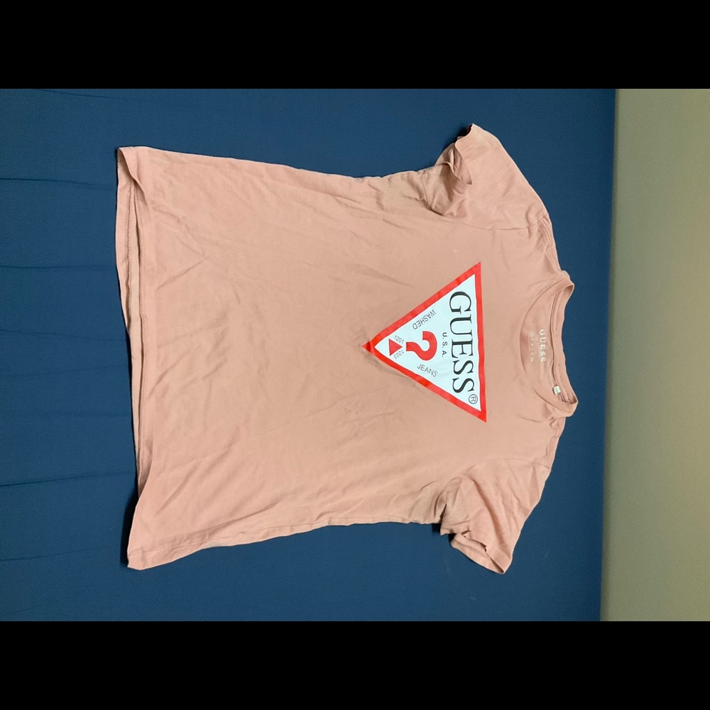 Guess T-shirt in a size extra small, it is peachy pink in color